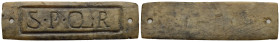 Roman tag marked "S P Q R". Circa 1st - 3rd centuries AD (Bone, 57.96 x 16.51 mm). Two small nail holes at sides indicate it was meant to be affixed. ...