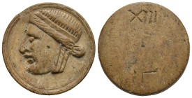 Roman Theater Admission Token. Circa 1st - 3rd centuries AD (Bone, 30.34 mm, 4.45 g). Tragic mask facing left. Rev. Blank, with graffiti: XIII above a...