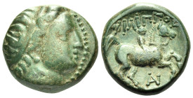 KINGS OF MACEDON. Philip II, 359-336 BC. (Bronze, 16 mm, 5.86 g, 3 h), uncertain mint in Macedon. Head of Apollo to right, wearing tainia. Rev. ΦΙΛΙΠΠ...