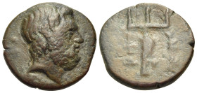 EUBOIA. Karystos. 197-146 BC. (Bronze, 16 mm, 4.16 g, 12 h). Bearded head of Poseidon to right. Rev. Κ-Α/Ρ-Υ/Σ/Τ/Ι/Ω-Ν Trident with a dolphin winding ...