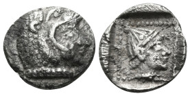 ASIA MINOR. Uncertain mint. Circa 5th century BC. Obol (Silver, 9 mm, 0.76 g, 3 h). Head of Herakles to right, wearing lion's skin headdress. Rev. Fem...