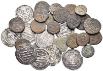 ISLAMIC. Circa 7th-8th century AD. (Silver/Bronze, 82.00 g). Large lot of twenty-nine (29) coins, consisting of nine Abbasid silver Dirhams and twenty...