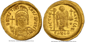 Justinian I the Great (AD 527-565). AV solidus (21mm, 4.34 gm, 7h). NGC Choice AU 2/5 - 4/5, clipped. Constantinople, 10th officina, ca. AD 545-565. D...