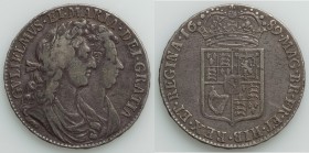 William & Mary 1/2 Crown 1689 VF, KM472.1, S-3434. 32.9mm. 14.60gm. First bust of William & Mary / First crowned shield with pearls, caul & interior f...