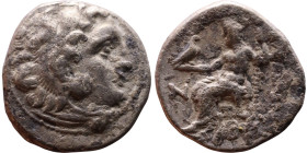 Alexander III (336-323 BC) Silver coin Obverse: Head of Herakles to right, wearing lion skin headdress Rev: Zeus seated left on low throne, holding lo...