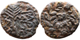 Claudius (41-54) Tiberias in Palestine Bronze. Obv: Palm branch; date across field Rev: TIBE-ΡIAC in two lines within wreath.

16mm 3,78g
