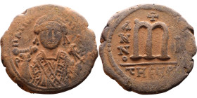 Tiberius II Constantine (578-582). Follis. Obverse: mperor, crowned and mantled bust facing, holding mappa and eagle-tipped sceptre, cross above eagle...