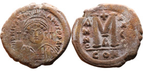 Justinian I (527-565) Follis. Obverse: DN IVSTINIANVS PP AVG, Armoured facing bust holding globus Reverse: Large M between ANNO and regnal year

33m...