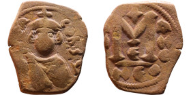 Constans II (641-668) Follis. Obverse: Imperial figure holding cross and globus Reverse: m and inscription

19mm 3,39g

Artificial sand patina
