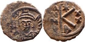 Maurice Tiberius (582-602) Half Follis. Obverse: Helmeted and cuirassed bust facing, holding globus cruciger and shield., Reverse: Large K above cross...