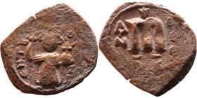 Constans II (641-668) Follis. Obverse: Imperial figure holding cross and globus Reverse: m and inscription

24mm 4,32g