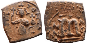 Constans II (641-668) Follis. Obverse: Imperial figure holding cross and globus Reverse: m and inscription

19mm 3,91g

Artificial sand patina