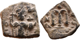 Constans II (641-668) Follis. Obverse: Imperial figure holding cross and globus Reverse: m and inscription

18mm 3,22g
