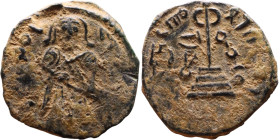 al-Malik ibn Marwan (687-705) Follis. Obverse: Standing caliph Reverse: Modified cross potent set on steps

19mm 3,82g