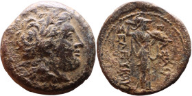 Seleukos I Nikator (Seleukid King: 312-260 BC). AE bronze. Obv.: Laureate head of Apollo right, with wavy locks Rev: Athena Promachos standing right, ...