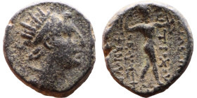 Antiochus IV Epiphanes (Seleukid King: 175-172 BC). AE bronze. Obv.: Radiate, diademed head of King Rev: Nude Apollo standing right, holding bow exten...