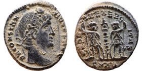 Constantius II (337-361) Follis. Obverse: Draped, cuirassed bust right. Reverse: GLORIA EXERCITVS, two Soldiers standing front, heads turned inward at...