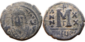 Maurice Tiberius (582-602) Follis Obverse: Crowned bust facing, wearing consular robes, holding mappa and eagle-tipped scepter , Reverse: Large M cros...
