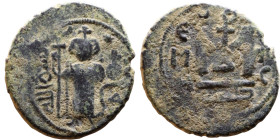 al-Malik ibn Marwan (687-705), Byzantine style folis Obverse: Imperial figure holding globe and cross Reverse: M and inscription

21mm 4.07g