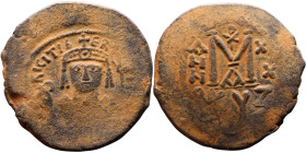Maurice Tiberius (582-602) Follis Obverse: Crowned bust facing, wearing consular robes, holding mappa and eagle-tipped scepter , Reverse: Large M cros...