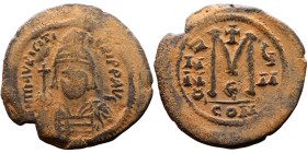 Maurice Tiberius (582-602) Follis. Obverse: Helmeted and cuirassed bust facing, holding globus cruciger and shield., Reverse: Large M above cross, ANN...