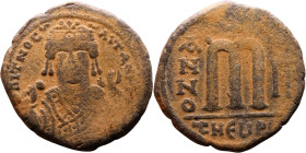 Tiberius II Constantine (578-582). Follis. Obverse: mperor, crowned and mantled bust facing, holding mappa and eagle-tipped sceptre, cross above eagle...