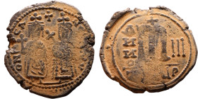 Phocas and Leontia.(602-610) Follis. Obverse: Standing Phocas and Leonita Reverse: Large m between ANNO and regnal year.

Artificial sand patina

...