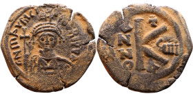 Maurice Tiberius (582-602) Half Follis. Obverse: Helmeted and cuirassed bust facing, holding globus cruciger and shield., Reverse: Large K above cross...