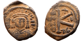 Maurice Tiberius (582-602) Half Follis. Obverse: Helmeted and cuirassed bust facing, holding globus cruciger and shield., Reverse: Large K above cross...
