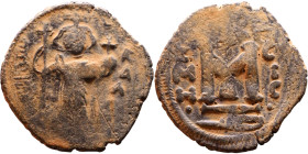 al-Malik ibn Marwan (687-705), Byzantine style folis Obverse: Imperial figure holding globe and cross Reverse: M and inscription

Artificial sand pa...