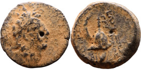 Tryphon (Seleukid King: 142-138 BC). AE bronze. Obv.: Diademed bust of Tryphonos right. Rev: Macedonian helmet decorated with spike and Ibex horn, apl...