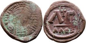 Justinian I (527-565) 33 nummi. Obverse: DN IVSTINIANVS PP AVG, Armoured facing bust holding globus Reverse: Large ΛΓ, cross above. 

27mm 14.41g