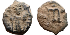 Constans II (641-668) Follis. Obverse: Imperial figure holding cross and globus Reverse: m and inscription

19mm 4.48g