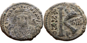 Maurice Tiberius (582-602) Half Follis Obverse: Crowned bust facing, wearing consular robes, holding mappa and eagle-tipped scepter , Reverse: Large K...