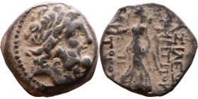 Syria: Apameia ad Orontem Semi-autonomous issue. (I Century) Bronze coin. Obv: Diademed head of Zeus right  Rev: Nike walking left, holding wreath and...