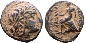 Seleucus II Callinicus (Seleukid King: 246-225 BC). AE bronze. Obv.: Diademed head of King Rev: Apollo seated left on omphalos, testing arrow and rest...