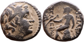 Seleucus II Callinicus (Seleukid King: 246-225 BC). AE bronze. Obv.: Diademed head of King Rev: Apollo seated left on omphalos, testing arrow and rest...
