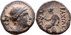 Seleucus II Callinicus (Seleukid King: 246-225 BC). AE bronze. Obv.: Diademed head of King Rev: Apollo seated left on omphalos, testing arrow and rest...