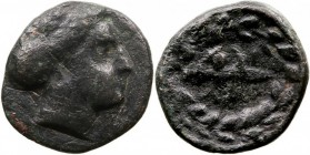 TESALIA. Larissa. AE-12. (C. 302-286 a.C.) A/Cabeza de la ninfa a der. R/Corona. 1,87 g. ROGERS 317. Escasa. MBC-. Pátina negra.
