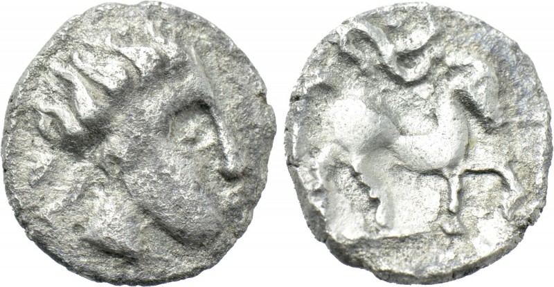 CENTRAL EUROPE. Boii. Obol (1st century BC). 

Obv: Stylized head right.
Rev:...