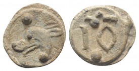 Roman PB Tessera, c. 1st century BC - 1st century AD (16mm, 3.37g, 2h). Hound head l.; pellet above and below. R/ Large IO; Ω and pellet above, pellet...