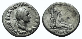 Vespasian (69-79). AR Denarius (19mm, 3.28g, 6h). “Judaea Capta” commemorative. Rome, 69-70. Laureate head r. R/ Trophy; to r., Judaea seated r. in at...