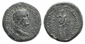 Vespasian (69-79). Lydia, Blaundus. Æ (24mm, 11.23g, 6h). Ti. Claudius Phoenix, Italicus procos. Laureate head r. R/ Dionysus standing facing, leaning...