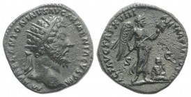 Marcus Aurelius (161-180). Æ Dupondius (25mm, 9.77g, 6h). Rome, 163-4. Radiate head r. R/ Victory standing r., holding trophy with both hands; at her ...