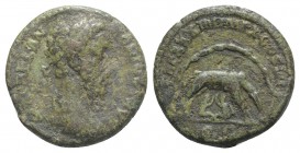 Marcus Aurelius (161-180). Æ As (25mm, 10.00g, 11h). Rome, AD 180. Laureate head r. R/ She-wolf standing r. within cave, suckling twins Remus and Romu...