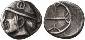 GAUL. Massalia. Circa 450-410 BC. Obol (Silver, 9 mm, 0.83 g). Male head with long hair to left, wearing helmet adorned with wheel of four spokes on t...