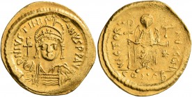 Justinian I, 527-565. Solidus (Gold, 22 mm, 4.44 g, 7 h), Constantinopolis, 545-565. D N IVSTINIANVS P P AVI Helmeted and cuirassed bust of Justinian ...
