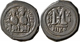 Justin II, with Sophia, 565-578. Follis (Bronze, 32 mm, 15.17 g, 7 h), Nicomedia, RY 11 = 575/6. D N IVSTINVS P P AVG Justin II, holding globus crucig...