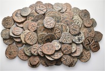 A lot containing 95 bronze coins. All: Byzantine. Fine to good very fine. LOT SOLD AS IS, NO RETURNS. 95 coins in lot.