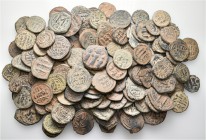 A lot containing 148 bronze coins. All: Early Islamic. Fine to very fine. LOT SOLD AS IS, NO RETURNS. 148 coins in lot.